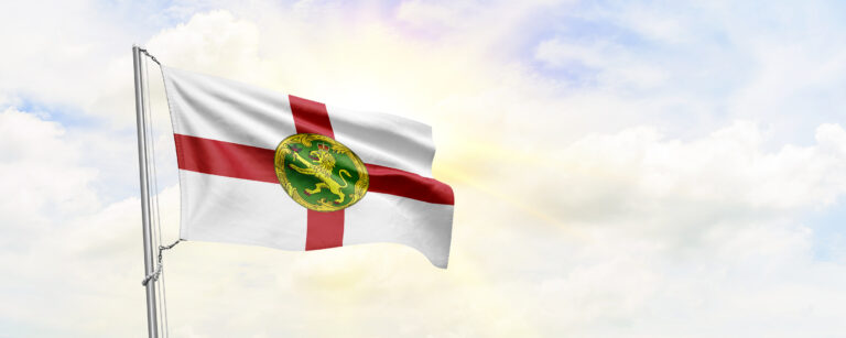 Alderney flag waving on sky background. 3D Rendering